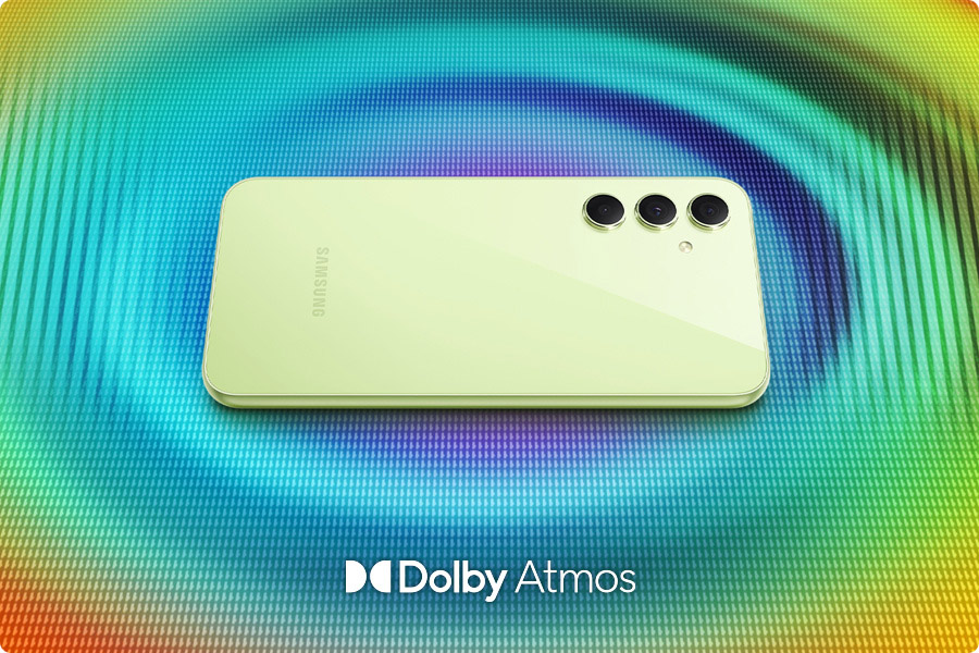 A Galaxy A54 5G is placed on a surface on its back with concentric waves in dynamic colors emitted from the phone. To the bottom, Dolby Atmos logo is shown.