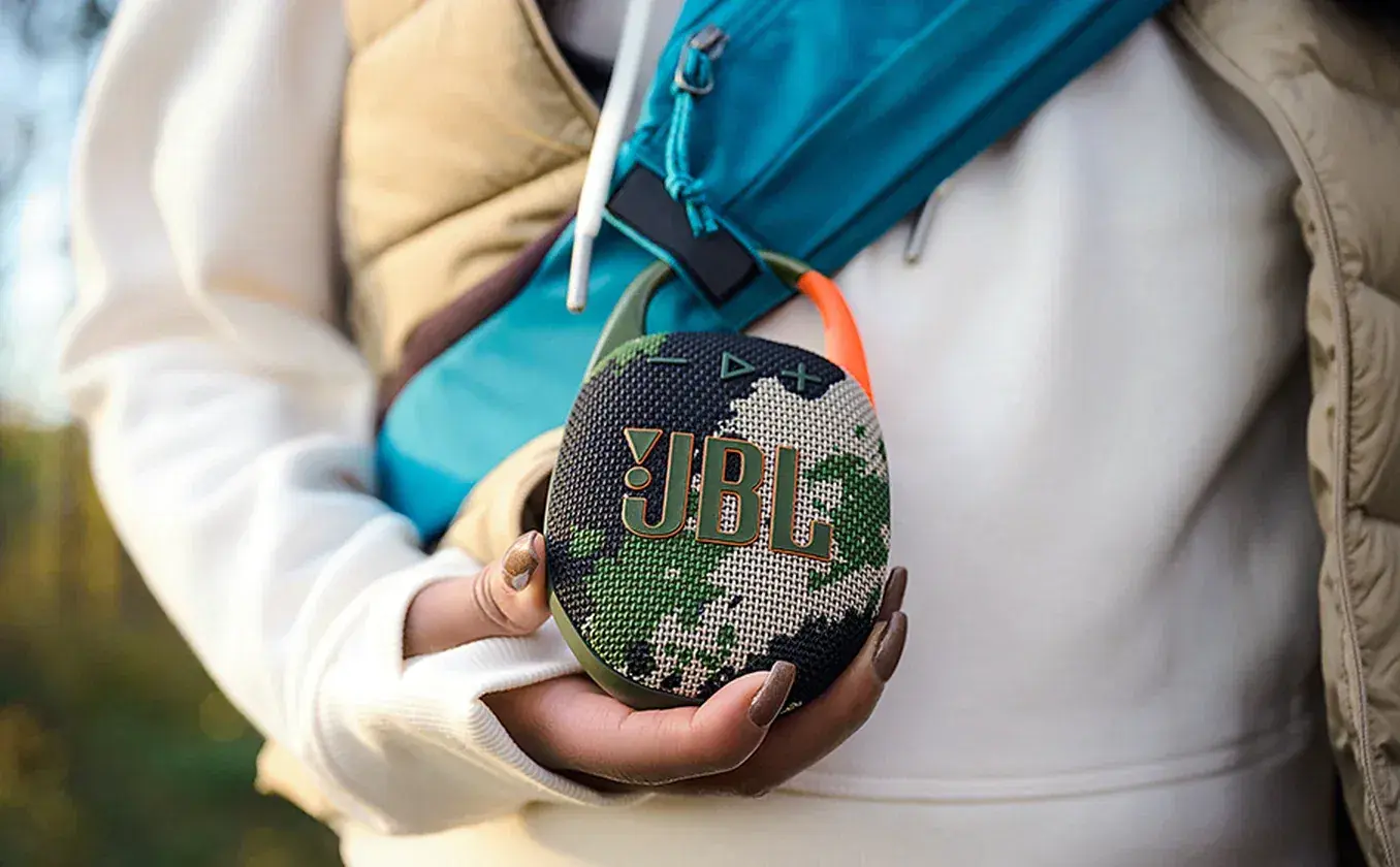 JBL Clip 5 ultra-portable Bluetooth speaker delivering JBL Pro Sound with punchy bass outdoors