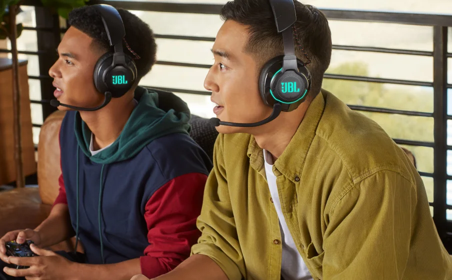 Two gamers wearing JBL Quantum 610 Wireless headset