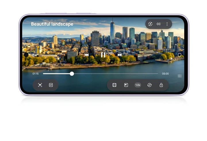 A video playing on a Galaxy A37 5G in landscape mode with text 'Beautiful landscape' onscreen. The video shows a wide view of a city by a river, gradually zooming into its dense buildings.
