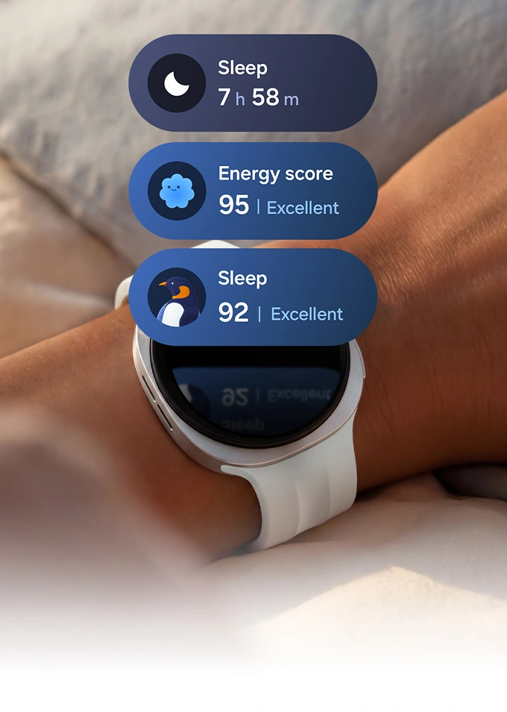 Galaxy Watch9 in Cream with a Sport Band in Cream worn on a person's wrist with light waves spreading from the watch along the person's arm to signify sleep tracking. Three sleep tracking tiles appear above the watch display, including a tile with sleep duration 7 h 58 m, a tile with an Excellent Energy score of 95 and a sleep coaching tile with a penguin icon and an Excellent sleep score of 92.