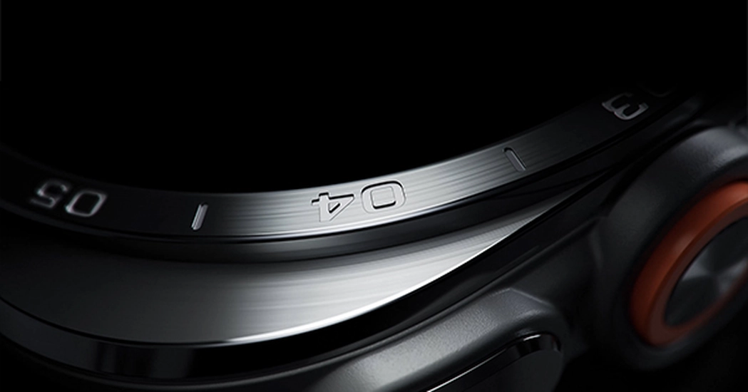 Close-up view of a Galaxy Watch Ultra2 in Titanium Silver showing its exterior design in detail, including Cushion design, refined bezel, sculpted edge and side buttons.