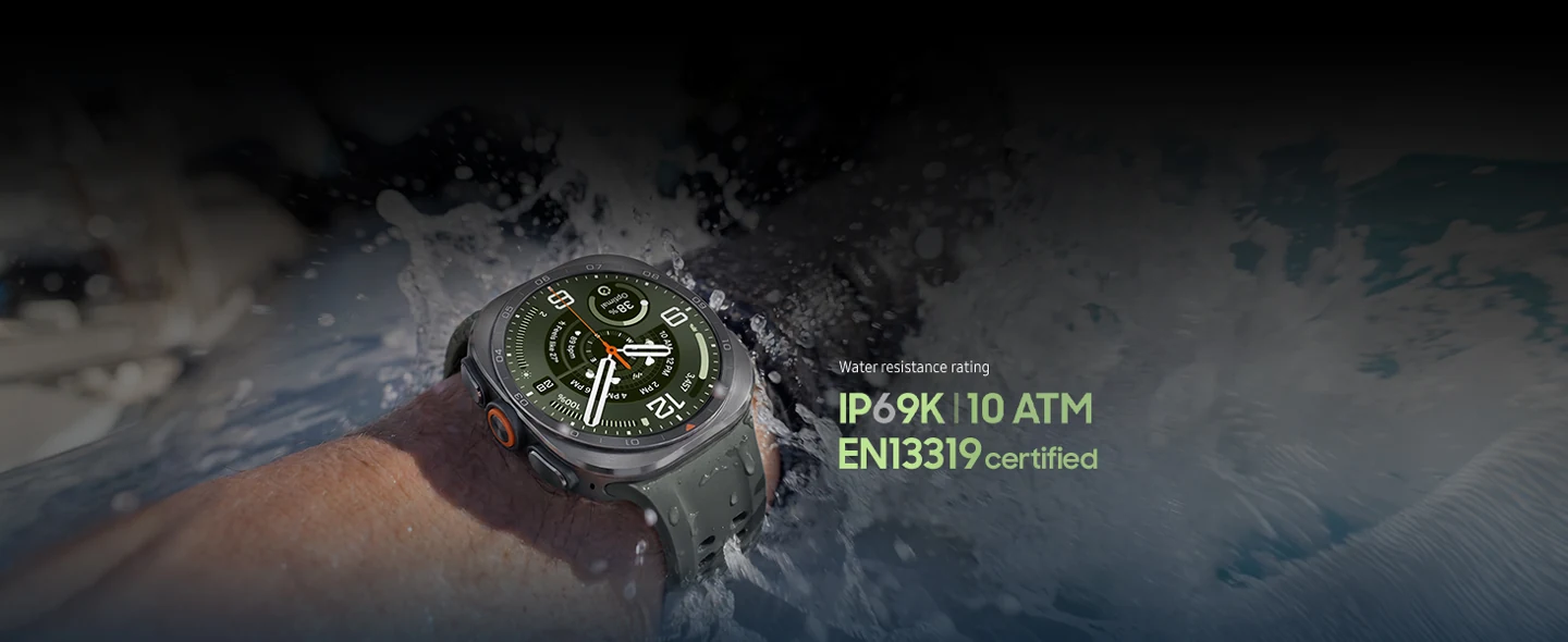 A person wearing a Galaxy Watch Ultra2 in Titanium Silver with a Marine Band in Olive with waves splashing against their wrist to demonstrate Galaxy Watch Ultra2 is ideal for open-water activities.