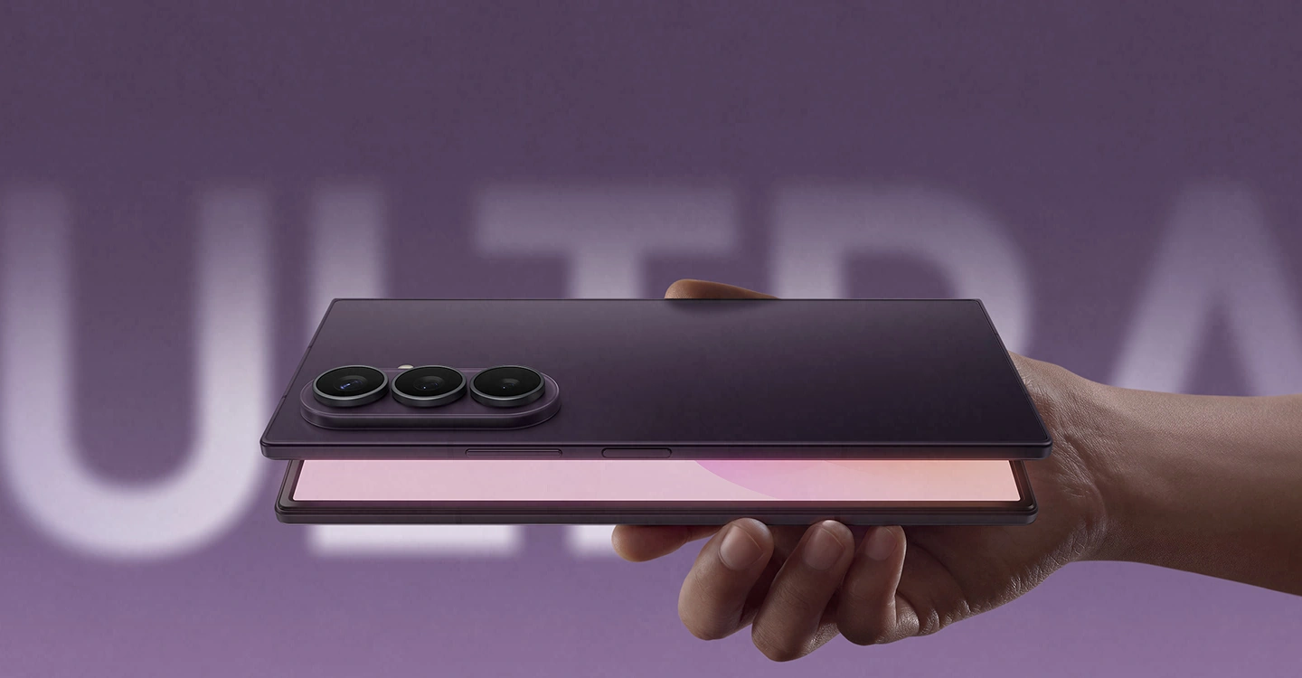 Partially unfolded Galaxy Z Fold8 Ultra is seen from the back. Light from the main screen illuminates the opening.