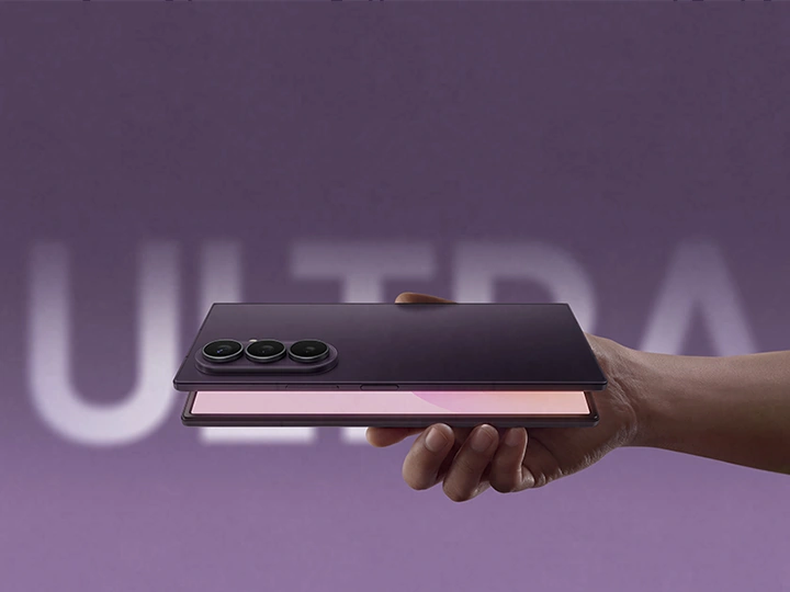 Partially unfolded Galaxy Z Fold8 Ultra is seen from the back. Light from the main screen illuminates the opening.