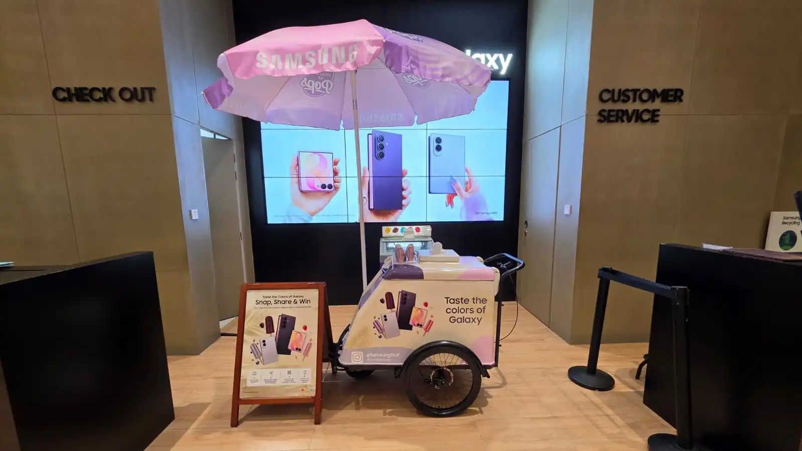 Signposts guiding visitors through the Taste Galaxy experience at The Galleria Al Maryah