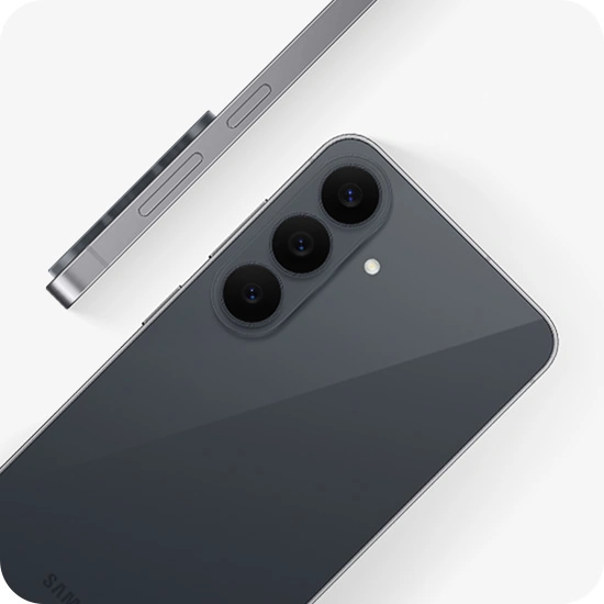 Galaxy S26 FE in Graphite is seen at an angle from the back, highlighting the camera bump with the Triple Camera. Another Galaxy S26 FE in Graphite is shown from the side view, highlighting the slim design.