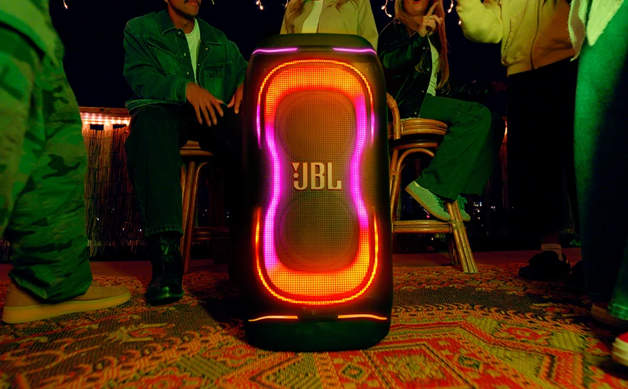 JBL PartyBox 330 lighting up a social gathering with its beat-synchronised lightshow