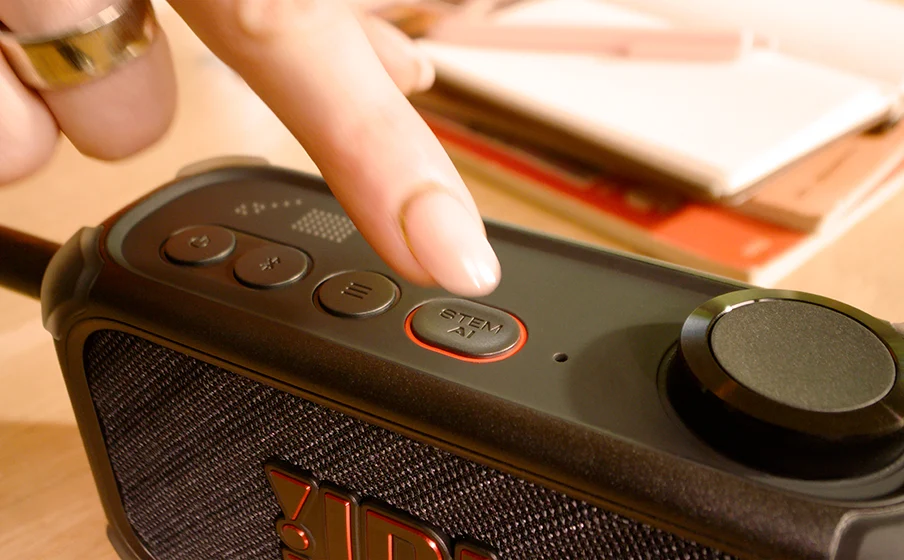 Musician using JBL BandBox Solo and Stem AI during a practice session