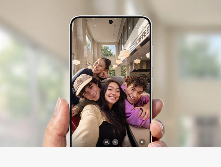 A group selfie. The 12 MP selfie camera helps fit more people into the frame while keeping details clear.