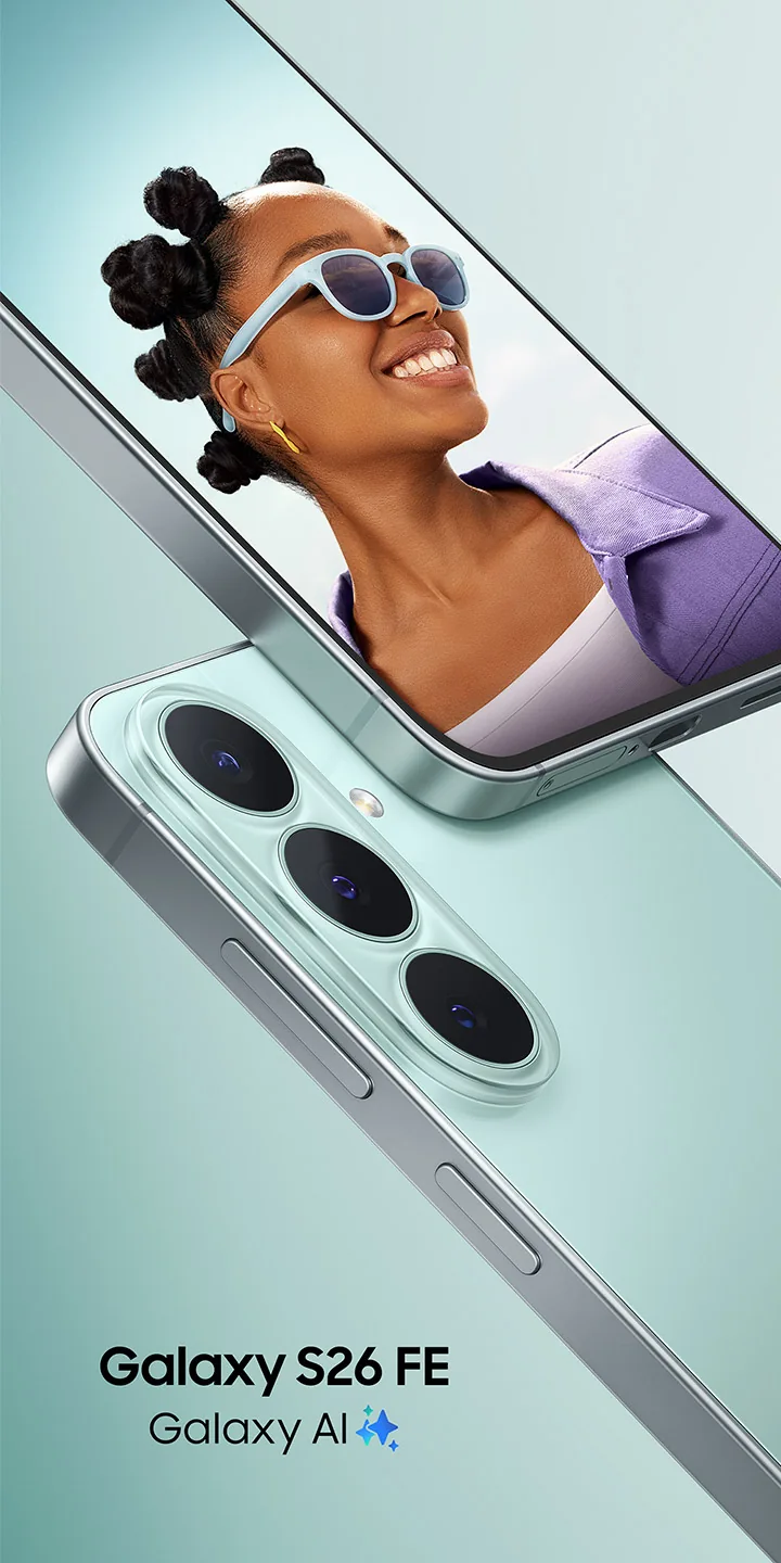 A close-up of two Galaxy S26 FE devices in Pistachio. One device is shown from the back, highlighting the triple rear camera design, while the other faces forward, displaying a vibrant photo of a smiling person wearing sunglasses. Galaxy S26 FE, Galaxy AI logo shown.