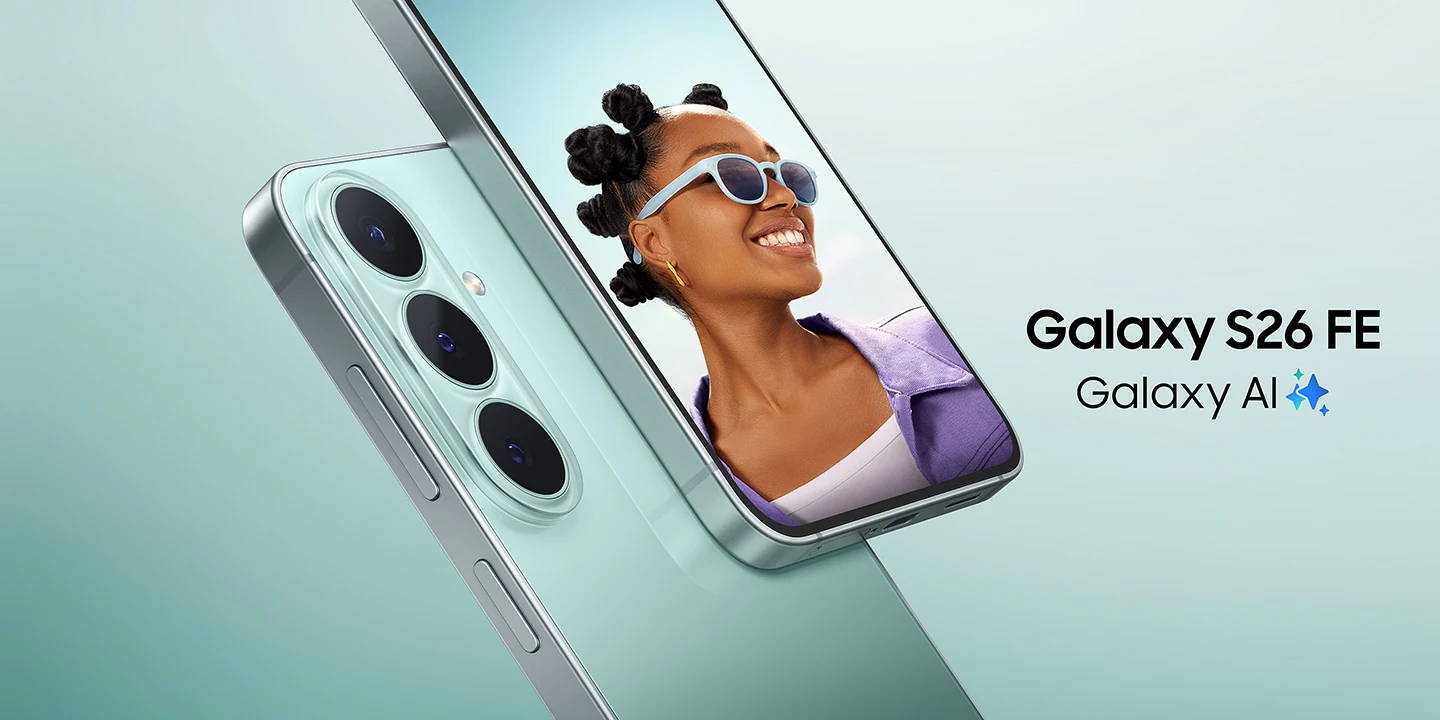 A close-up of two Galaxy S26 FE devices in Pistachio. One device is shown from the back, highlighting the triple rear camera design, while the other faces forward, displaying a vibrant photo of a smiling person wearing sunglasses. Galaxy S26 FE, Galaxy AI logo shown.