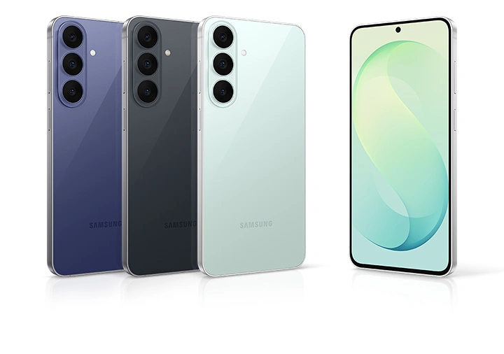 Three Samsung Galaxy S26 FE devices are arranged side by side, each slightly overlapping the one to its left. They are all upright with their backs facing forward and their left sides slightly tilted. The colors from left to right are Blueberry, Graphite, and Pistachio. Another Galaxy S26 FE device stands to the right of the three, with its screen facing forward and its right side slightly tilted.